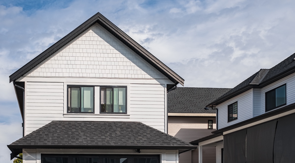 black roof with new white siding