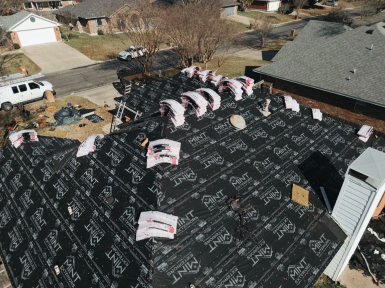 Roof replacement in progress by MINT Exteriors