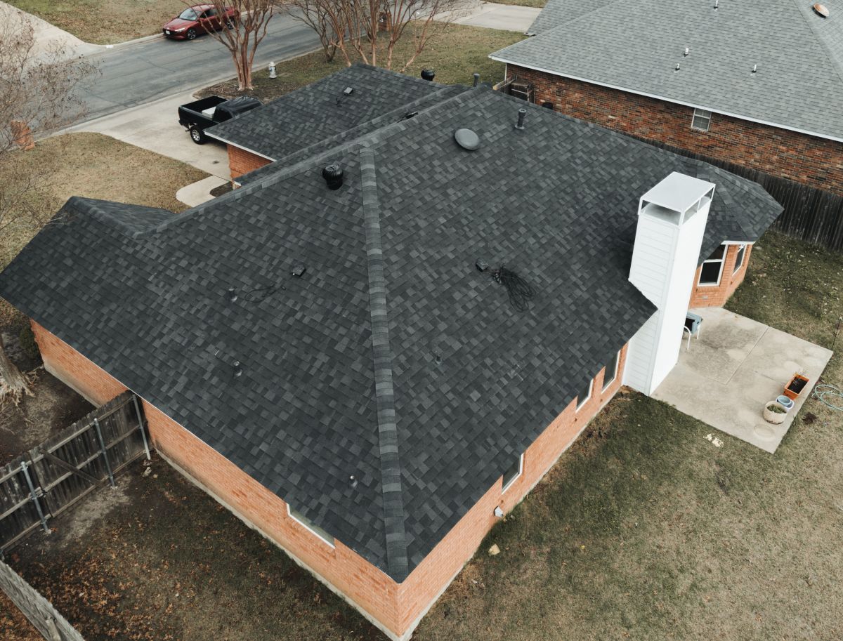 Aerial view of a dark asphalt shingle roof
